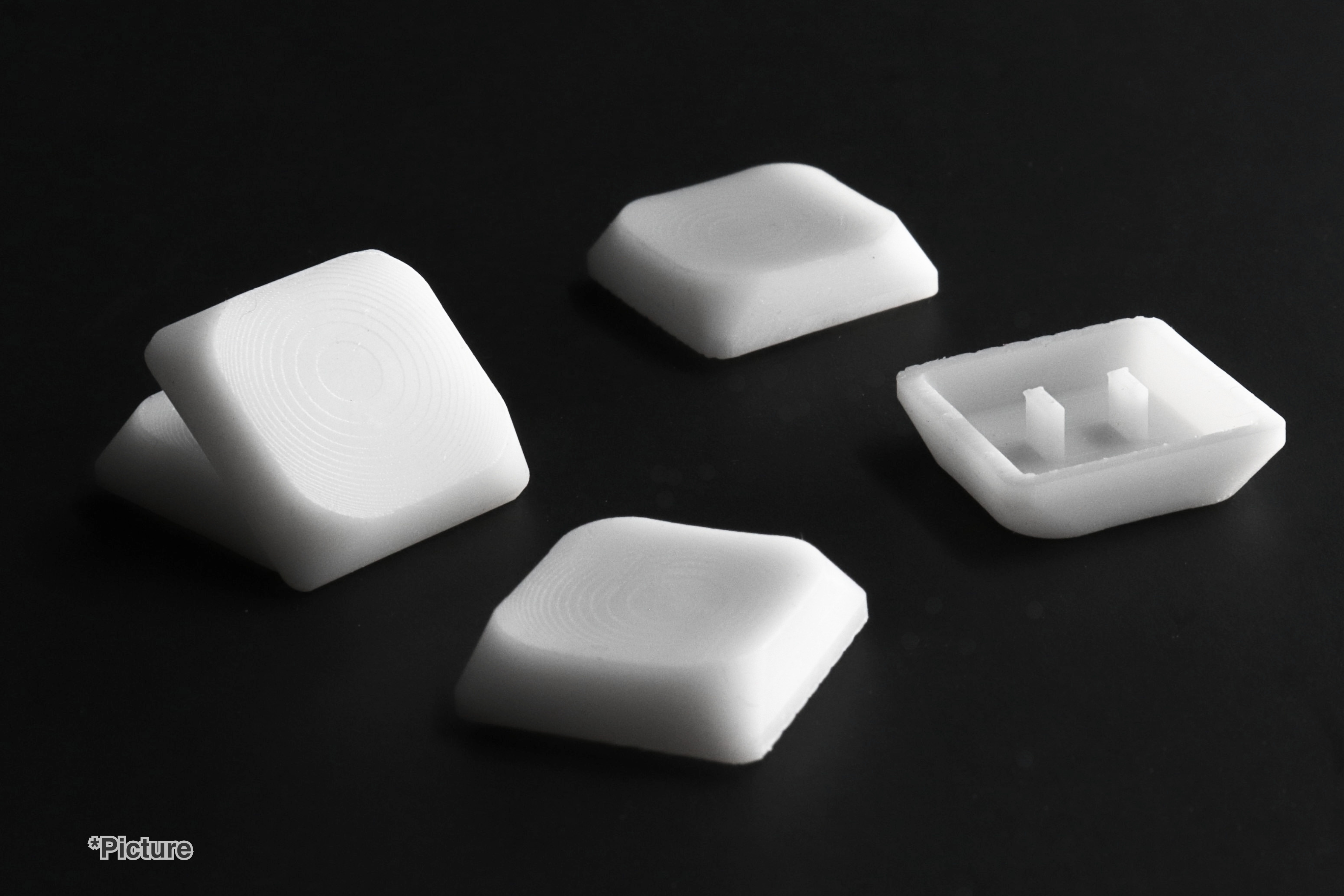 Choc Nuphy Keycaps Shown in White Resin