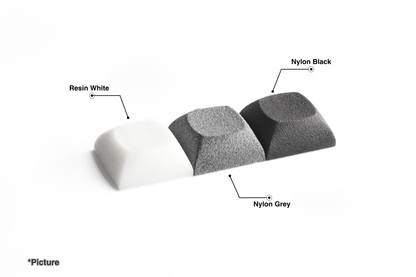 DSA Keycaps Shown in Nylon Black, Nylon Grey, and Resin White