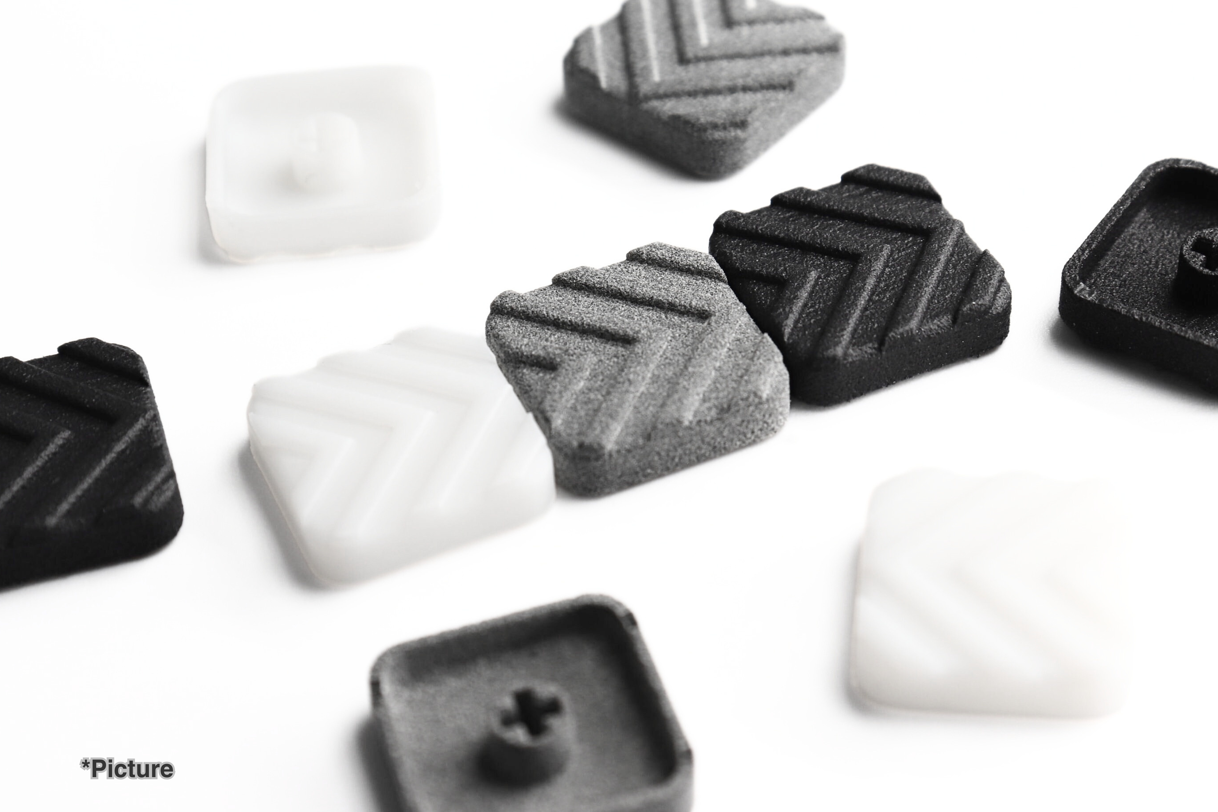 FMX Arrow Keycaps Shown in Different Material Options