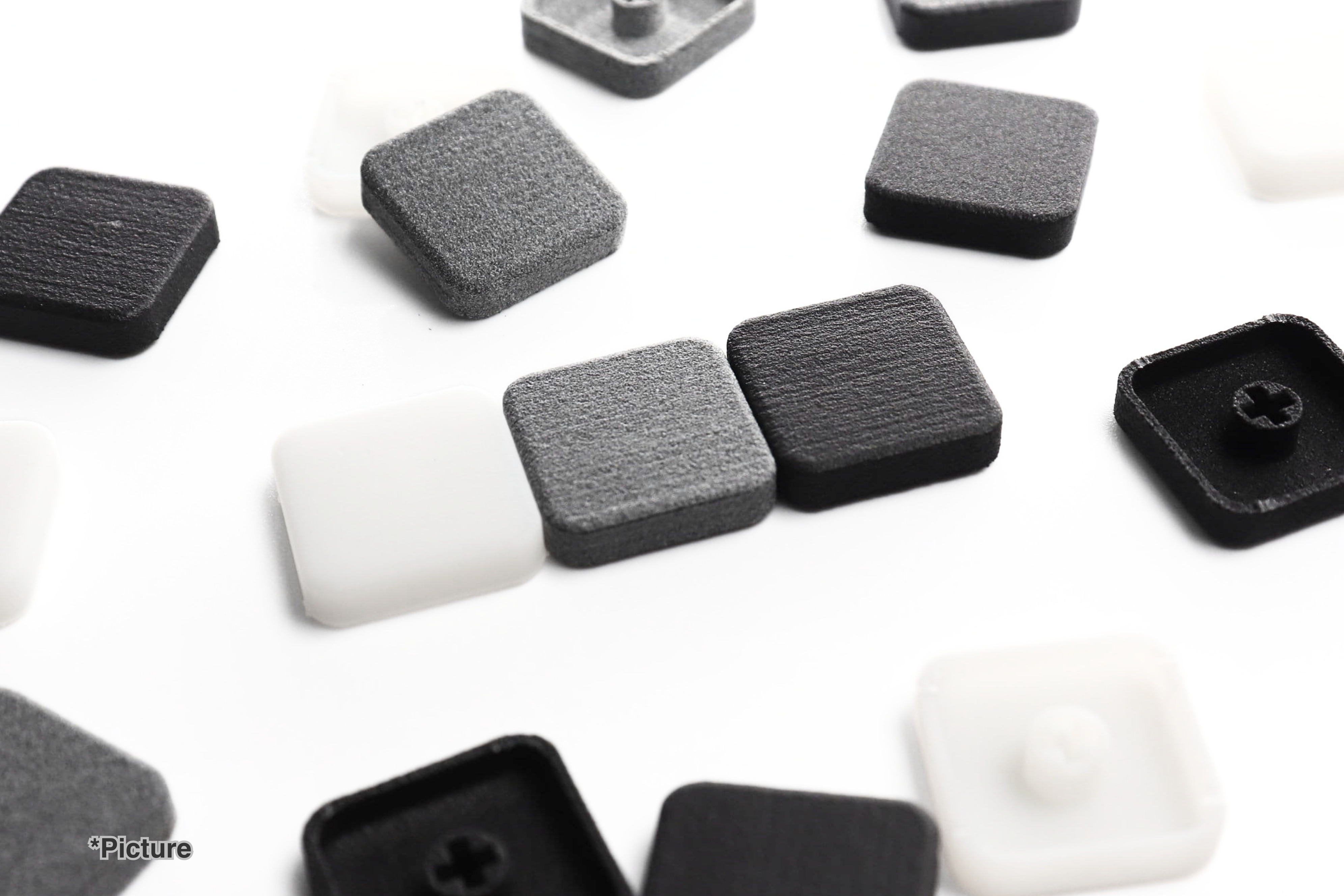 FMX Keycaps Shown in Resin and Nylon Materials