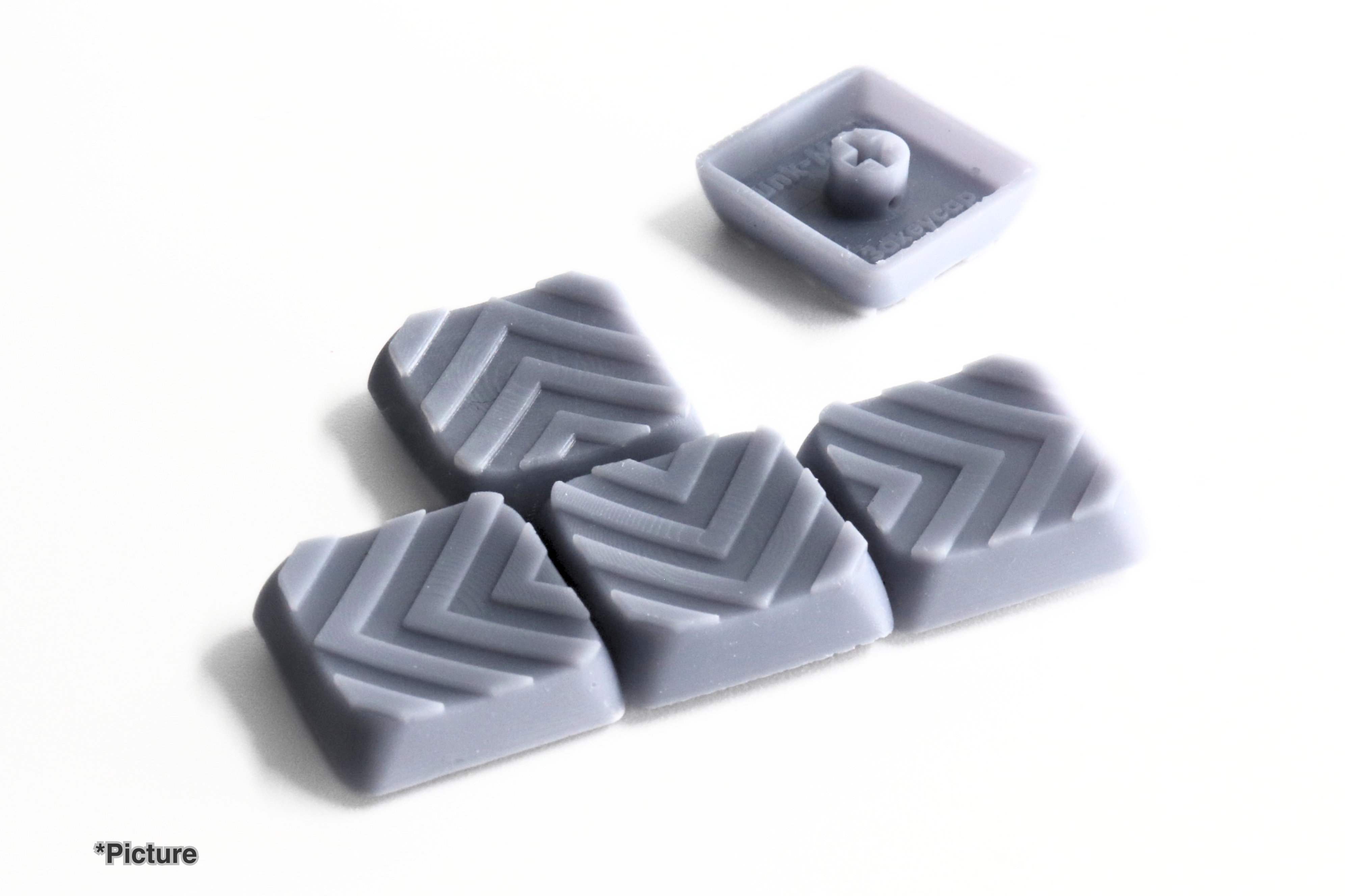 Funkmonk Arrow Keycap Set Shown in Grey Resin Variation