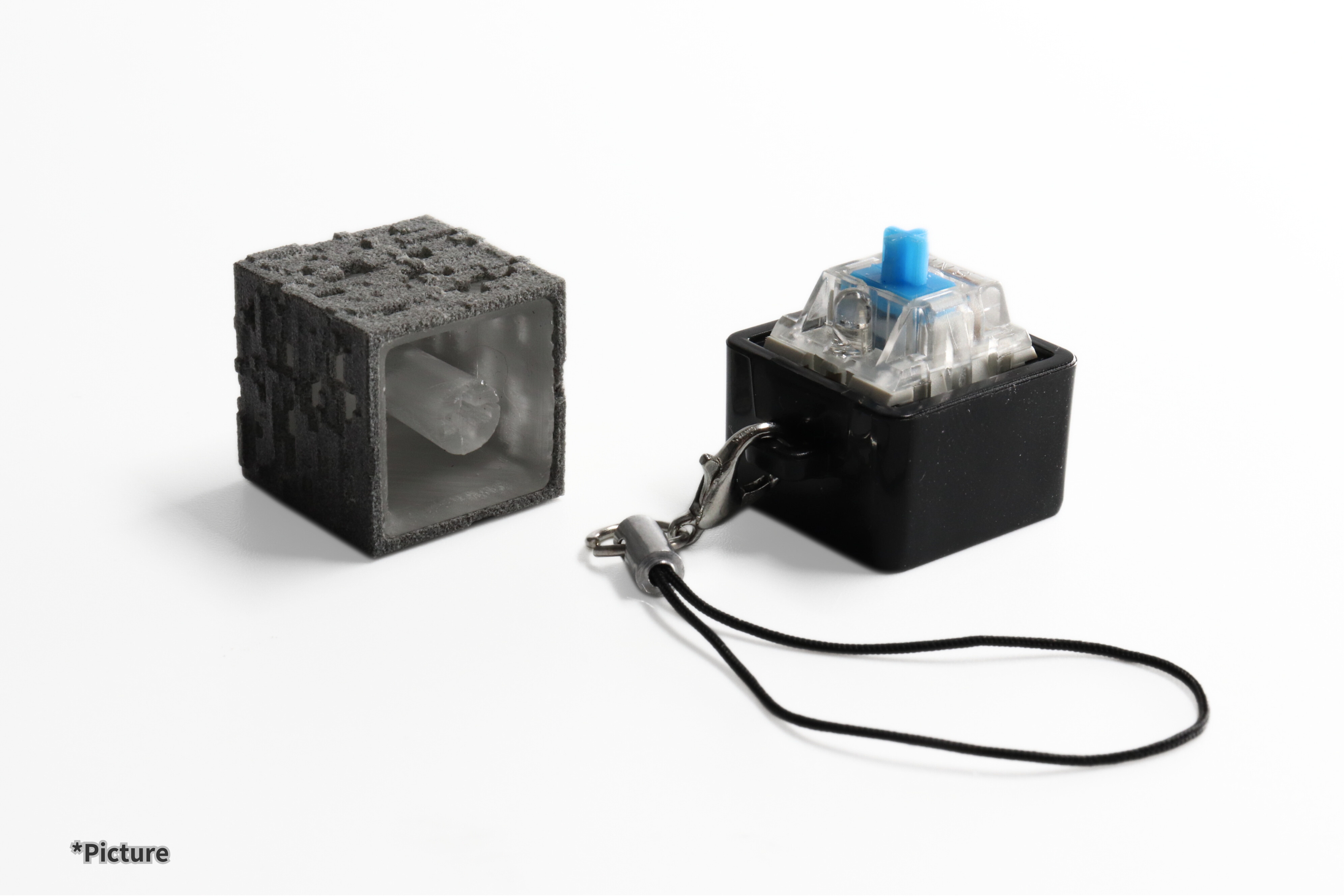 Minecraft ore keychain keycap displayed beside switch tester