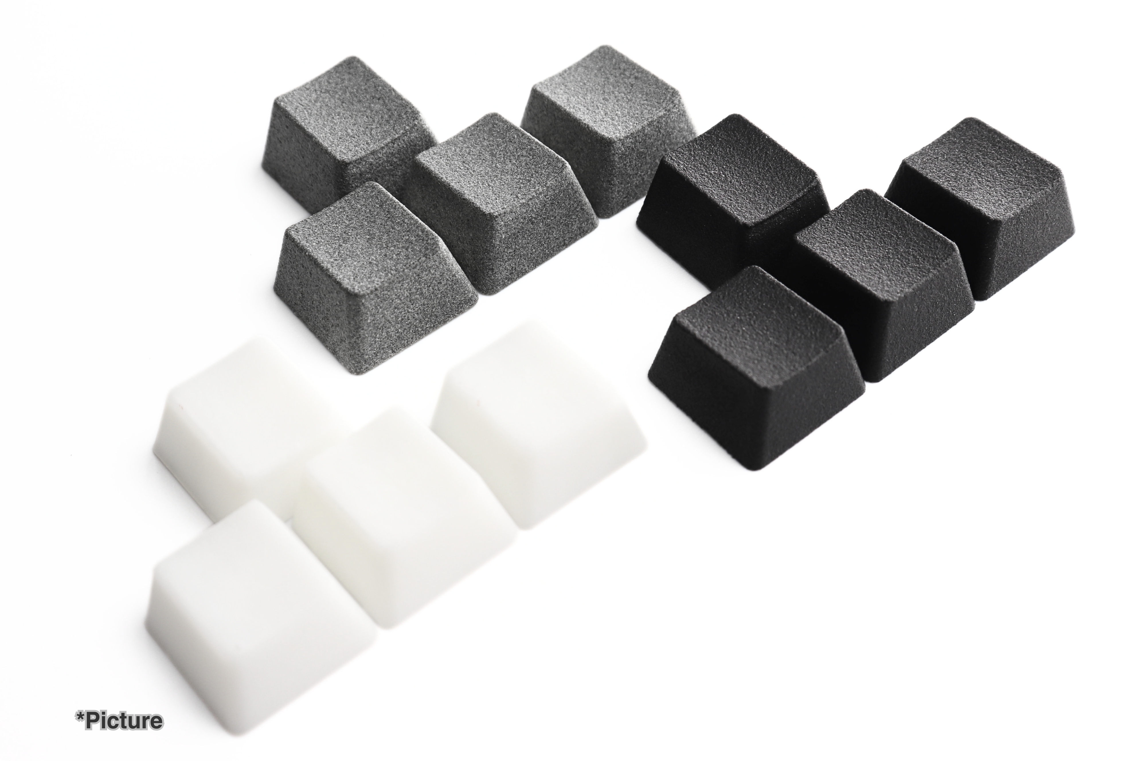 OEM WASD Keycaps Shown in Different Material Options
