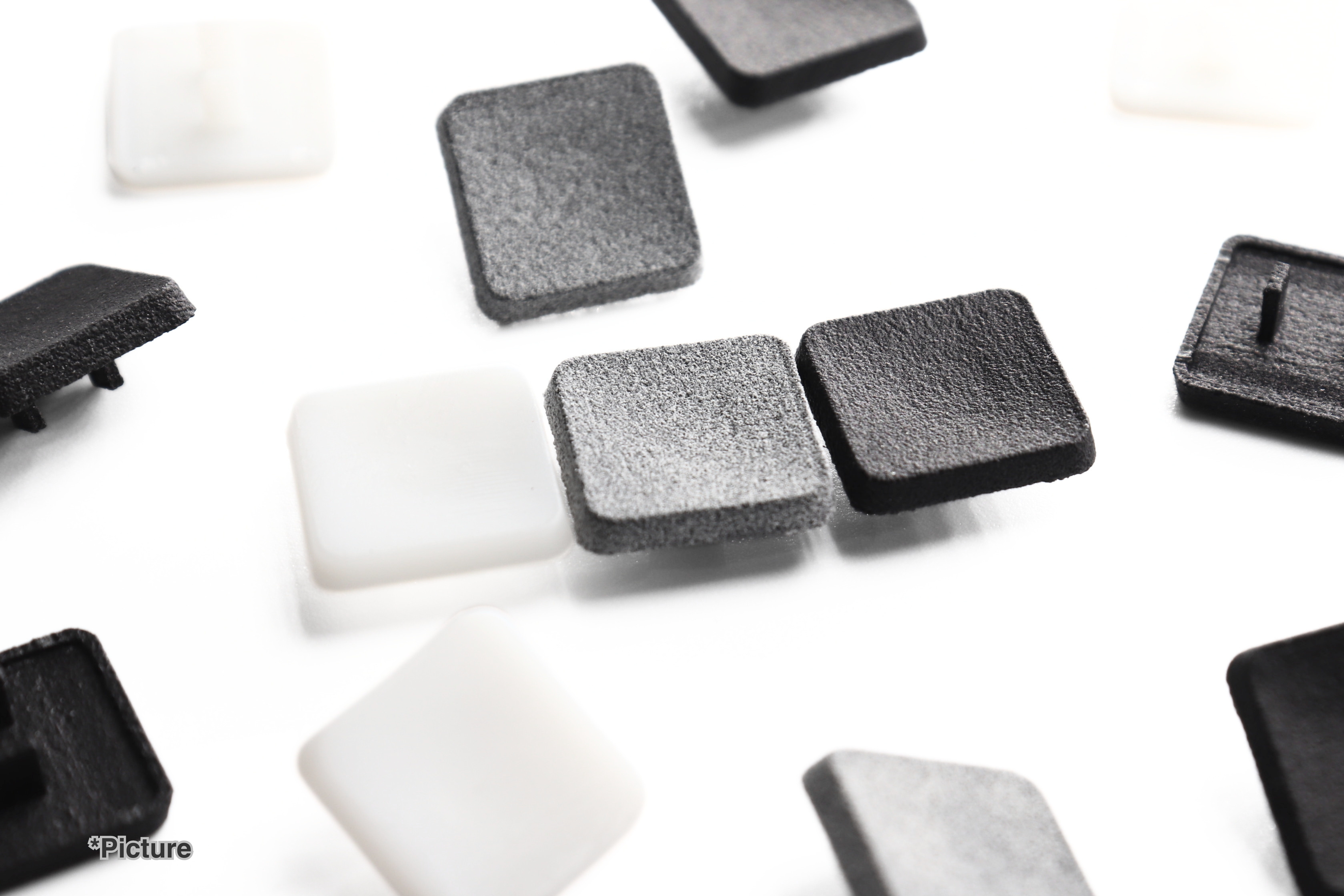 SCS Keycaps Shown in Resin and Nylon Materials